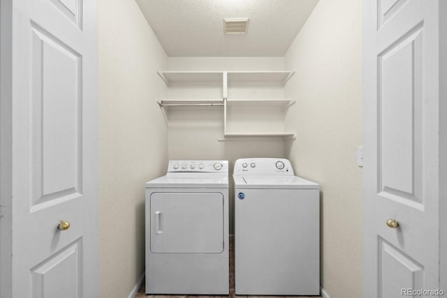 426 Plowman Way, Fort Collins, CO 80526 - laundry area with separate washer and dryer and a textured ceiling