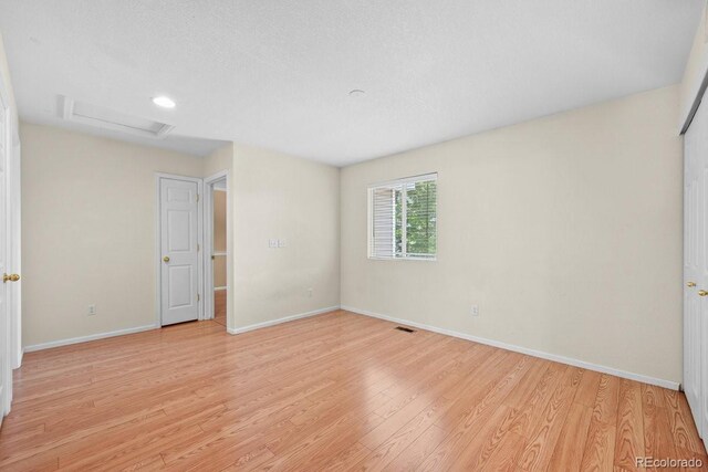 426 Plowman Way, Fort Collins, CO 80526 - spare room with attic access and light wood-style flooring