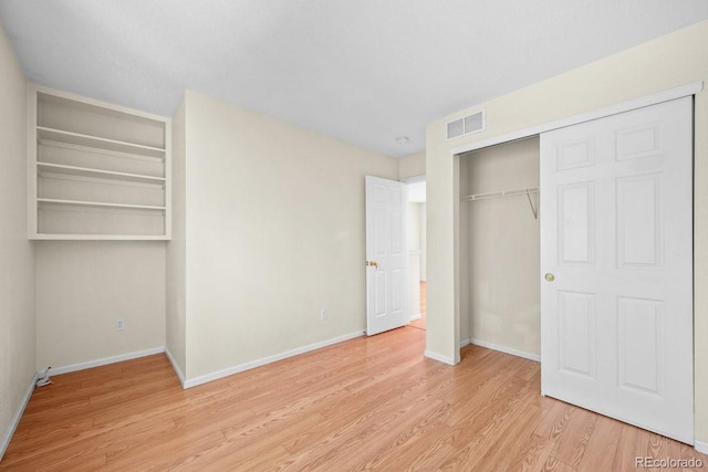 426 Plowman Way, Fort Collins, CO 80526 - unfurnished bedroom with light wood-style floors and a closet