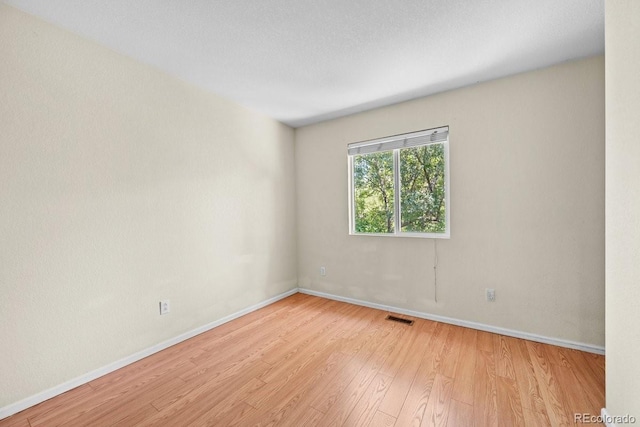 426 Plowman Way, Fort Collins, CO 80526 - empty room with wood finished floors and baseboards