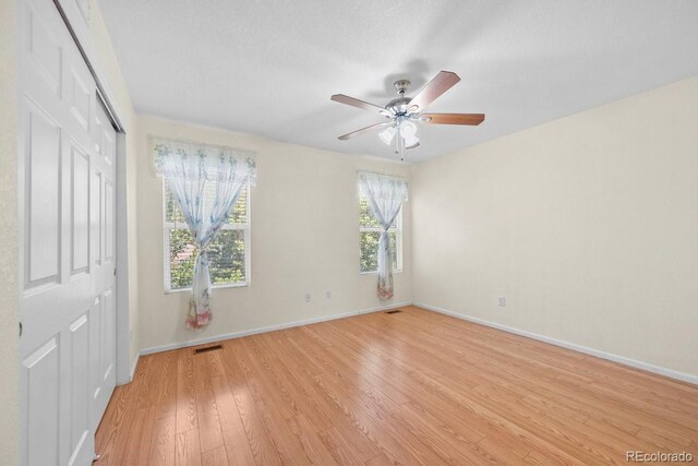 426 Plowman Way, Fort Collins, CO 80526 - unfurnished bedroom with light wood finished floors, a closet, and ceiling fan