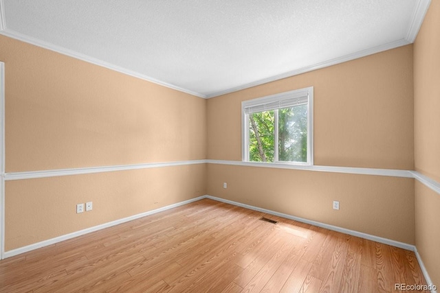 426 Plowman Way, Fort Collins, CO 80526 - spare room with wood finished floors and crown molding