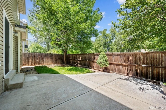 426 Plowman Way, Fort Collins, CO 80526 - fenced backyard featuring a patio
