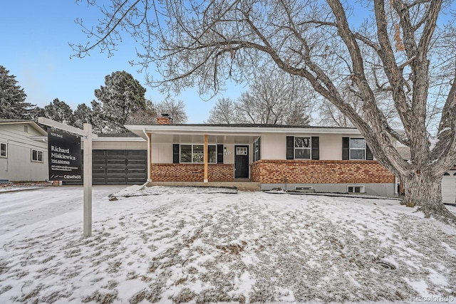 ranch-style home with a garage