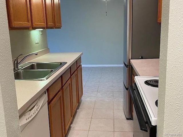 100 E Highline Cir Unit 105, Centennial, CO 80122 - kitchen featuring white appliances, a sink, brown cabinets, and light countertops
