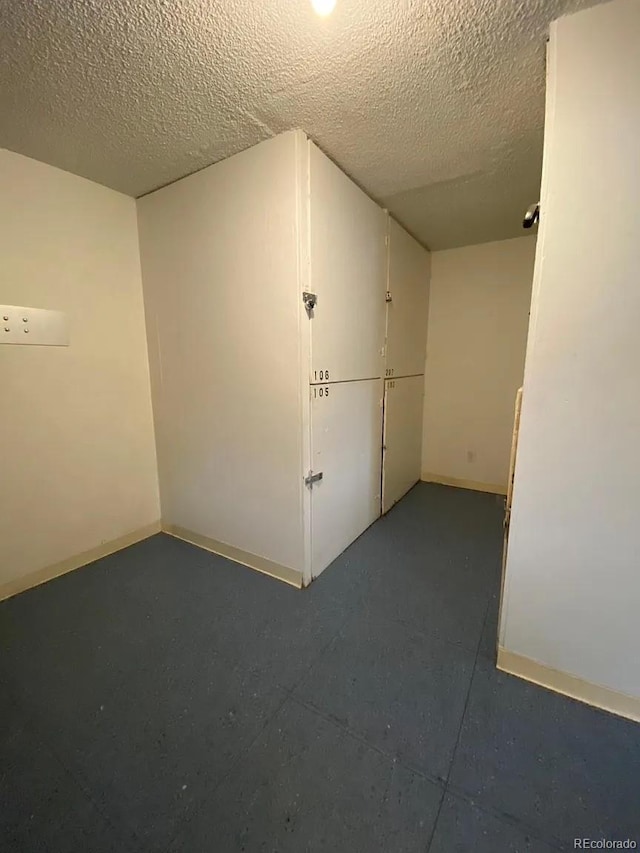 100 E Highline Cir Unit 105, Centennial, CO 80122 - empty room featuring a textured ceiling and baseboards