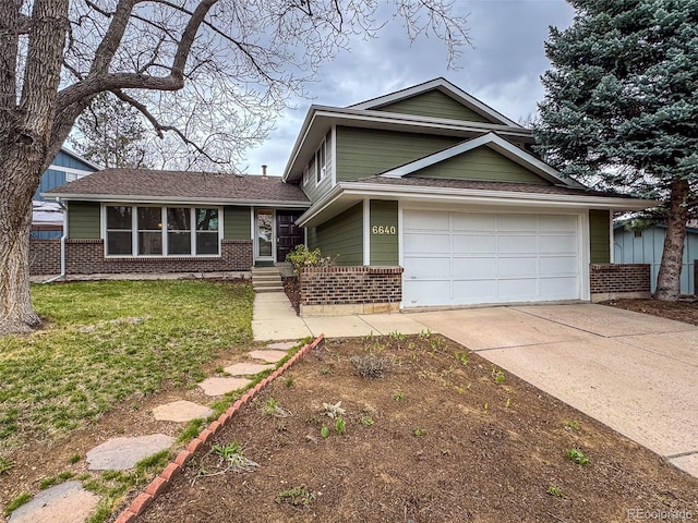 6640 S Heritage Pl W, Centennial, CO 80111 - view of front of home featuring brick siding, a front yard, and concrete driveway