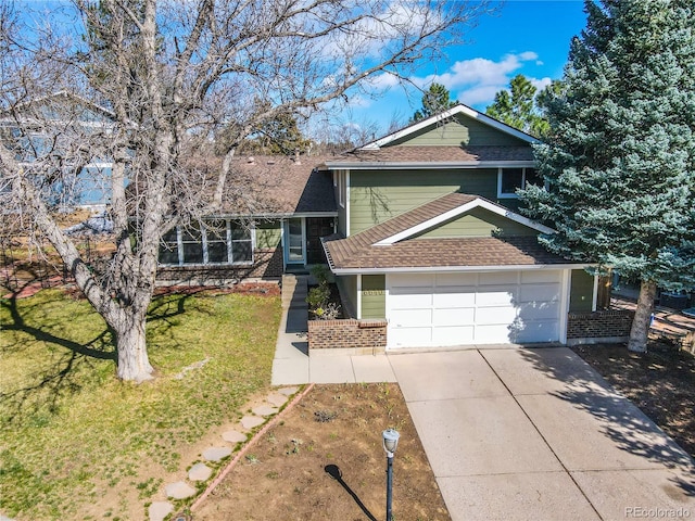 6640 S Heritage Pl W, Centennial, CO 80111 - view of front facade featuring a front yard, brick siding, driveway, and a shingled roof