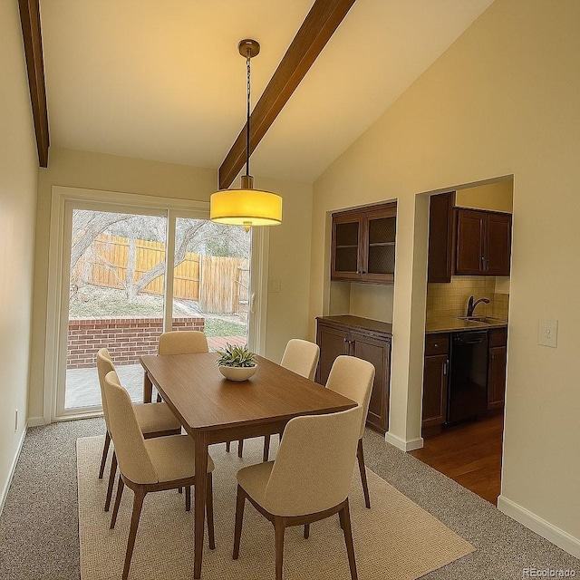 6640 S Heritage Pl W, Centennial, CO 80111 - dining room with carpet flooring, baseboards, and vaulted ceiling with beams