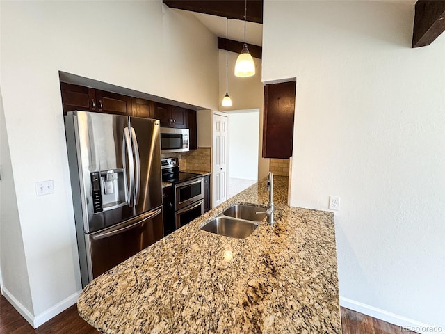 6640 S Heritage Pl W, Centennial, CO 80111 - kitchen with light stone countertops, dark brown cabinets, a sink, stainless steel appliances, and decorative backsplash
