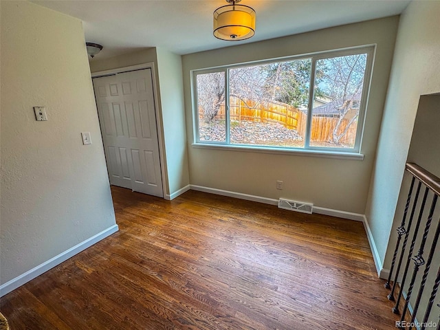 6640 S Heritage Pl W, Centennial, CO 80111 - unfurnished bedroom with wood finished floors, baseboards, and visible vents