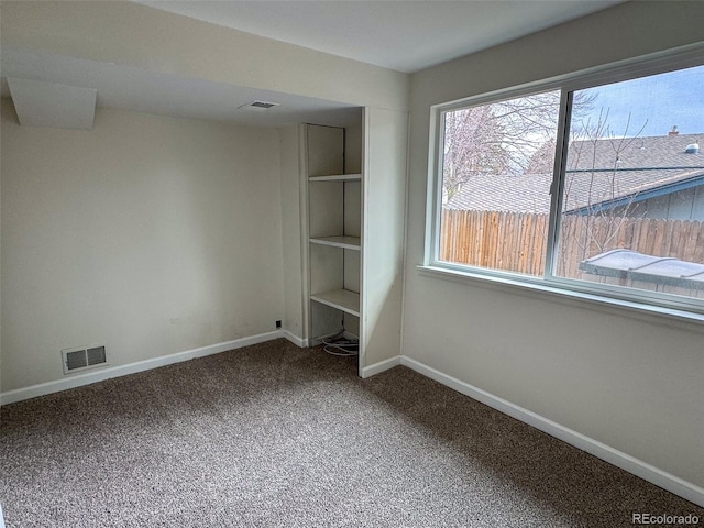 6640 S Heritage Pl W, Centennial, CO 80111 - unfurnished bedroom with visible vents, baseboards, and carpet floors