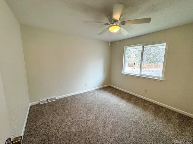 6640 S Heritage Pl W, Centennial, CO 80111 - spare room featuring visible vents, baseboards, dark colored carpet, and a textured ceiling