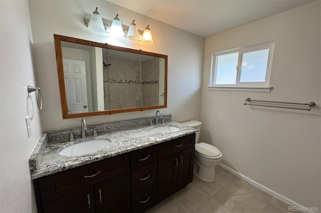 6640 S Heritage Pl W, Centennial, CO 80111 - full bathroom featuring tiled shower, double vanity, a sink, and toilet