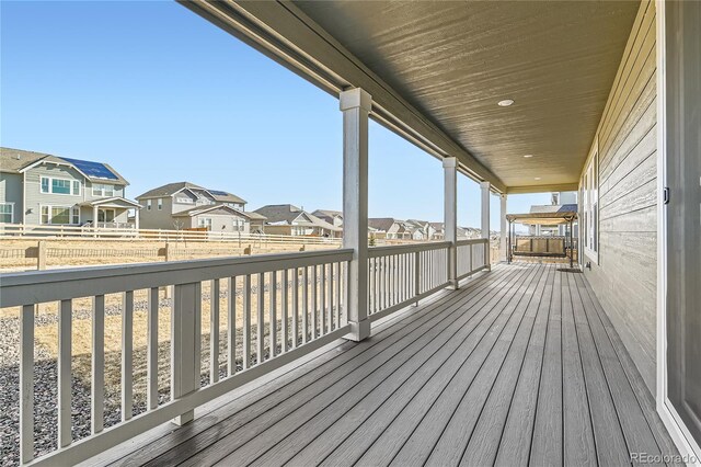 wooden deck featuring a residential view