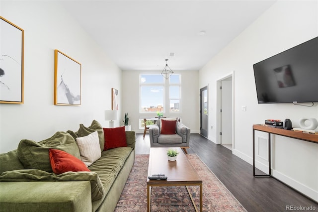 living area with dark wood finished floors and baseboards