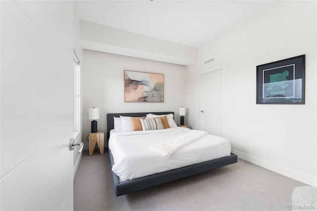 bedroom featuring carpet floors, visible vents, and baseboards