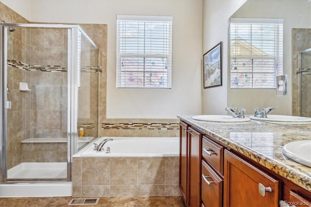 bathroom featuring a shower stall, visible vents, and plenty of natural light