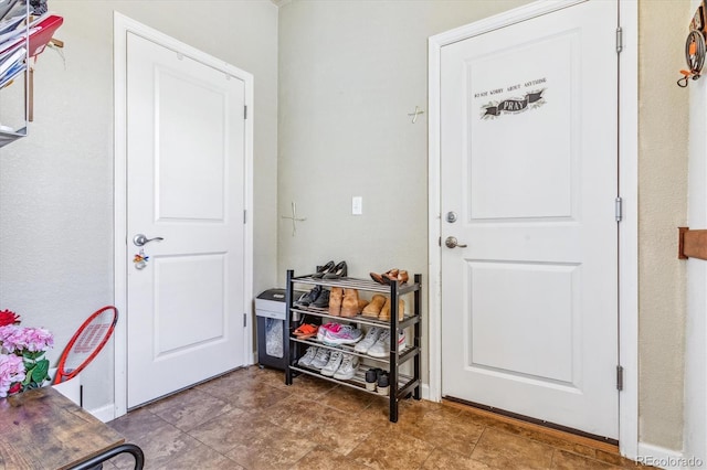 doorway with baseboards