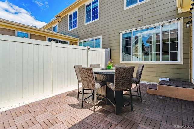 view of patio with fence and outdoor dining area