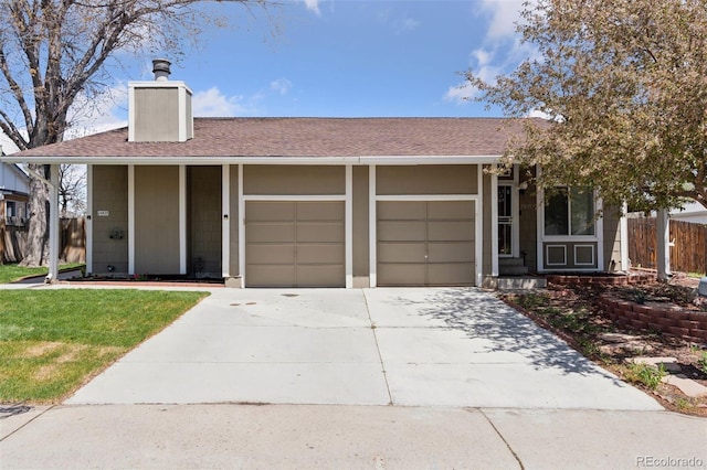 single story home with a garage, fence, a chimney, a shingled roof, and driveway