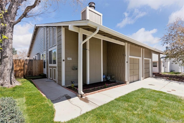 exterior space featuring fence and driveway