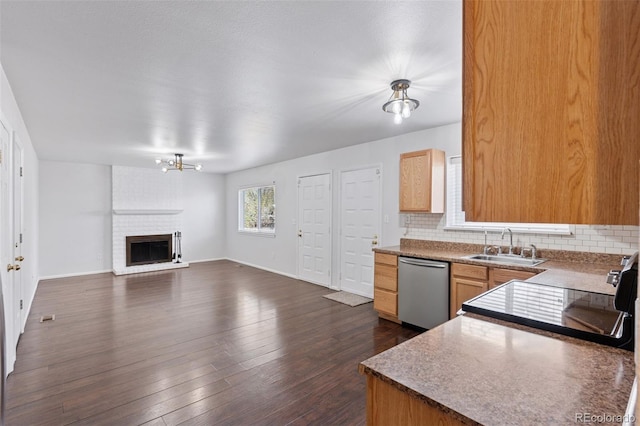 kitchen with stainless steel dishwasher, a sink, black electric range, and tasteful backsplash