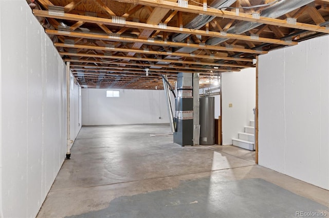 basement with water heater and stairway