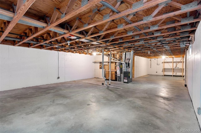 below grade area featuring water heater