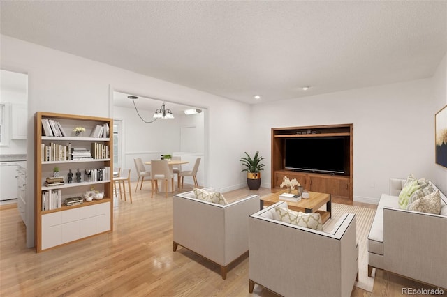 16839 E Amherst Ave E, Aurora, CO 80013 - living area featuring a chandelier, light wood-style flooring, and recessed lighting