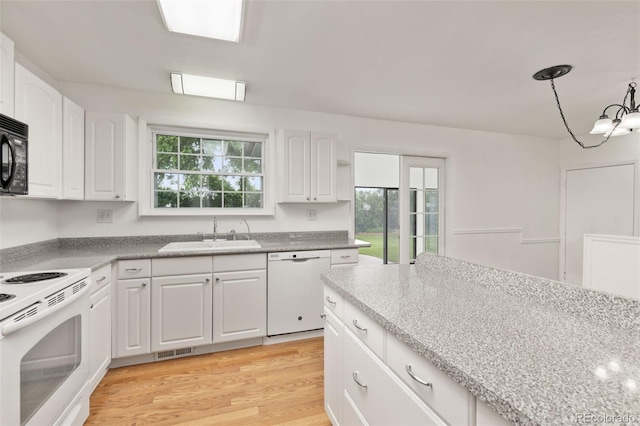 16839 E Amherst Ave E, Aurora, CO 80013 - kitchen with white appliances, white cabinetry, light wood-style flooring, and pendant lighting