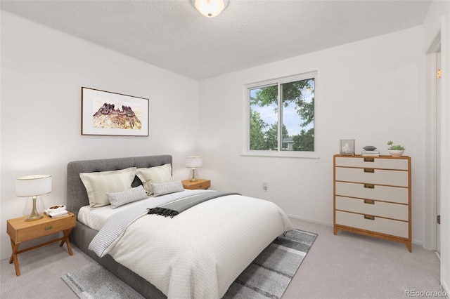 16839 E Amherst Ave E, Aurora, CO 80013 - bedroom featuring light carpet and a textured ceiling