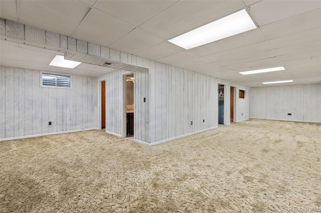16839 E Amherst Ave E, Aurora, CO 80013 - finished below grade area with a drop ceiling, carpet flooring, and wood walls