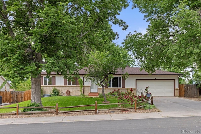 16839 E Amherst Ave E, Aurora, CO 80013 - view of front facade featuring a garage, brick siding, and driveway