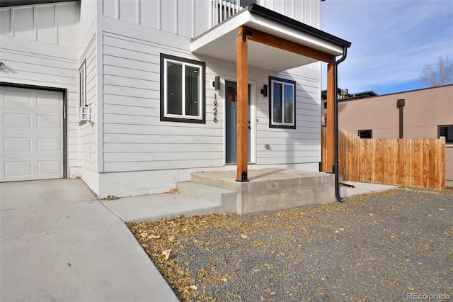 view of front of property with a balcony and a garage