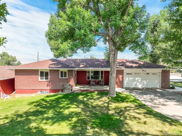 ranch-style house with a garage and a front lawn