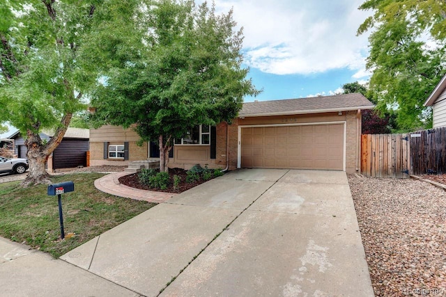 6640 S Dexter St, Centennial, CO 80121 - view of front of home featuring brick siding, an attached garage, and concrete driveway