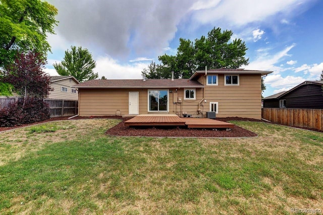 6640 S Dexter St, Centennial, CO 80121 - rear view of house featuring a fenced backyard and a wooden deck
