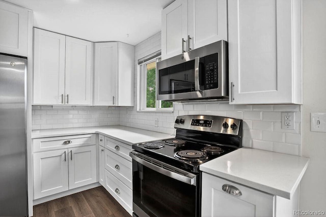 6640 S Dexter St, Centennial, CO 80121 - kitchen with stainless steel appliances, white cabinets, light countertops, and backsplash