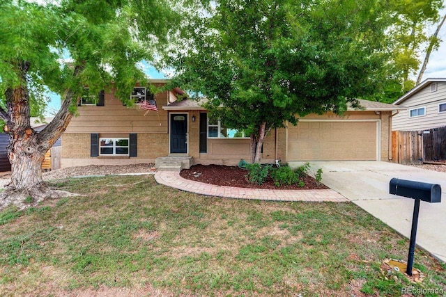6640 S Dexter St, Centennial, CO 80121 - tri-level home with brick siding, driveway, and a garage