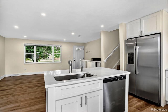 6640 S Dexter St, Centennial, CO 80121 - kitchen with appliances with stainless steel finishes, dark wood-style floors, white cabinets, light countertops, and recessed lighting