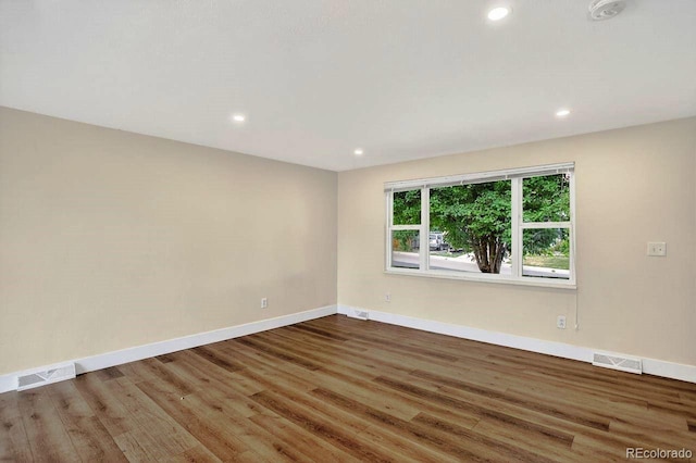 6640 S Dexter St, Centennial, CO 80121 - unfurnished room with wood finished floors, recessed lighting, and a smoke detector