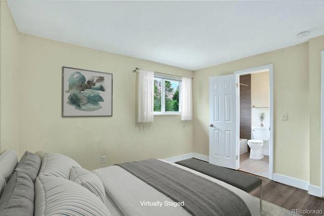 6640 S Dexter St, Centennial, CO 80121 - bedroom with wood finished floors and connected bathroom
