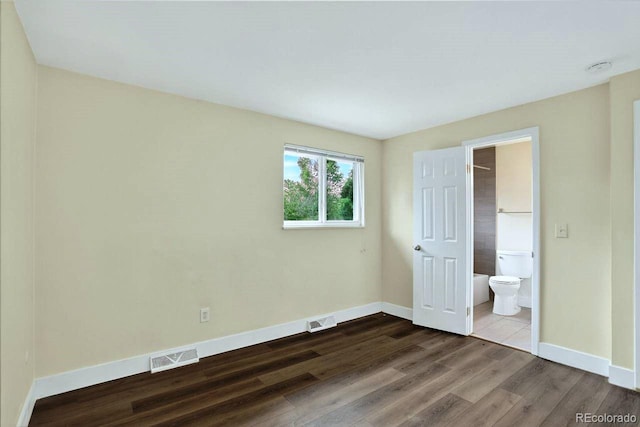 6640 S Dexter St, Centennial, CO 80121 - unfurnished bedroom featuring wood finished floors and connected bathroom