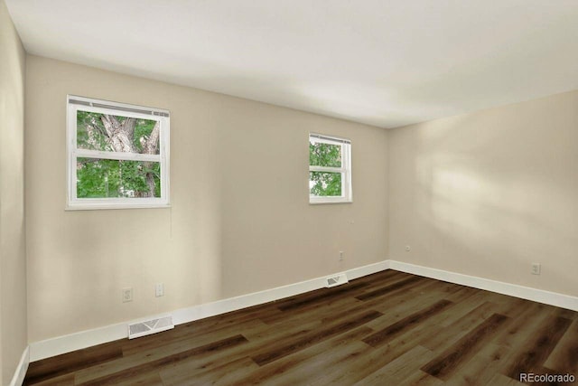 6640 S Dexter St, Centennial, CO 80121 - spare room featuring dark wood-style flooring