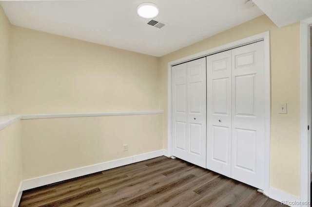 6640 S Dexter St, Centennial, CO 80121 - unfurnished bedroom with wood finished floors and a closet