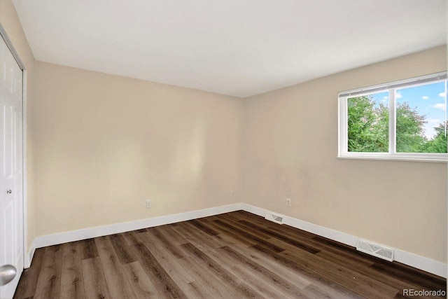6640 S Dexter St, Centennial, CO 80121 - empty room featuring dark wood-style flooring and baseboards