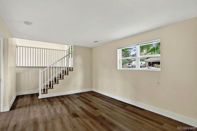 6640 S Dexter St, Centennial, CO 80121 - unfurnished room featuring wood finished floors, stairway, and a smoke detector