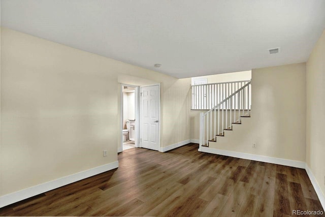 6640 S Dexter St, Centennial, CO 80121 - spare room featuring wood finished floors and stairway