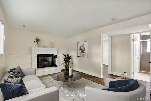 6640 S Dexter St, Centennial, CO 80121 - living room with wood finished floors and a brick fireplace